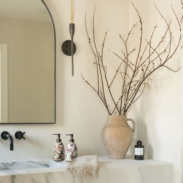 vintage floral ceramic soap dispenser on the washstand