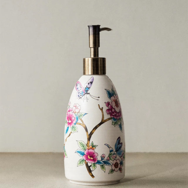 vintage floral ceramic soap dispenser with butterfly pattern
