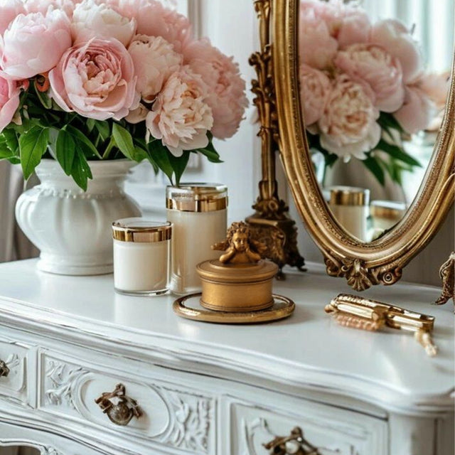vintage gold resin cherub trinket box on a dressing table