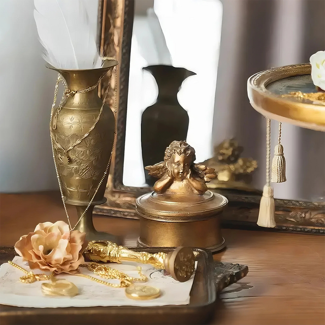 vintage gold round resin cherub trinket box near the mirror