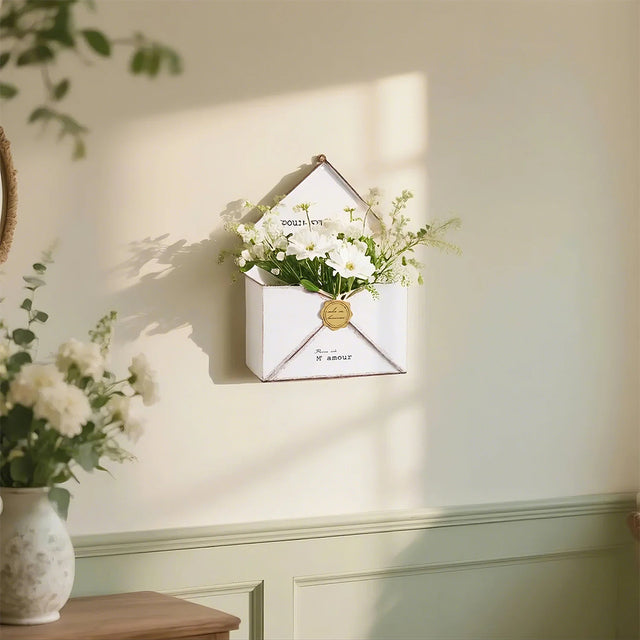 vintage green envelop planter on the wall