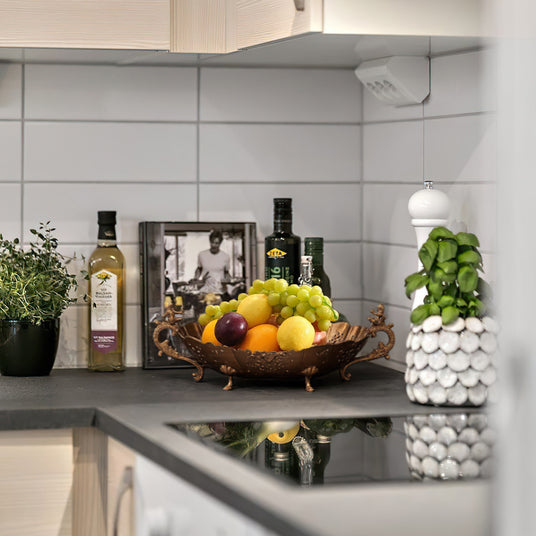 vintage hollow-out brass plate with handles in the kitchen
