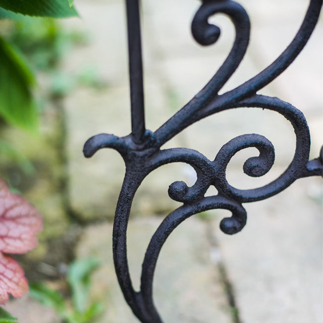 vintage metal plant stand close up