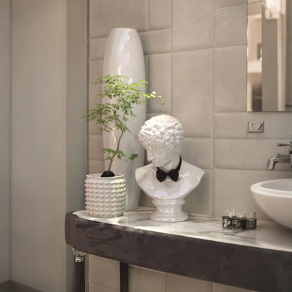 white cement dotted planter in the bathroom
