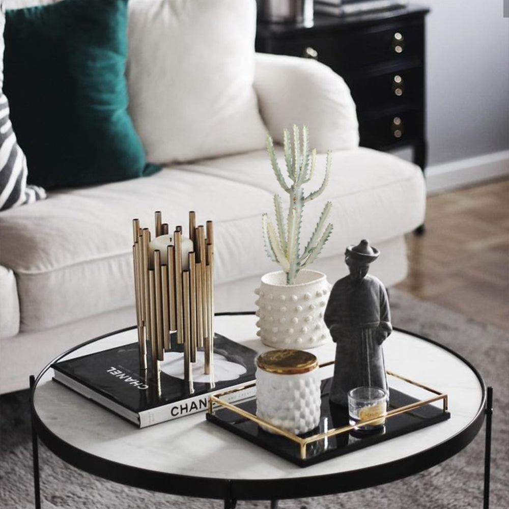 white cement dotted planter on the table