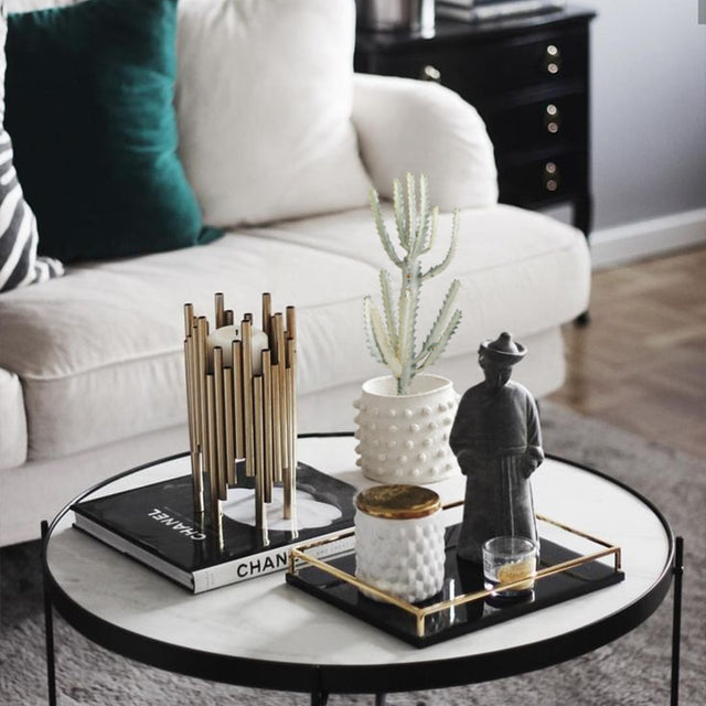 white cement dotted planter on the table