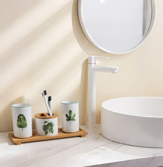 white ceramic bathroom set beside the sink