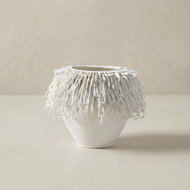 white ceramic loop fringe vase on beige