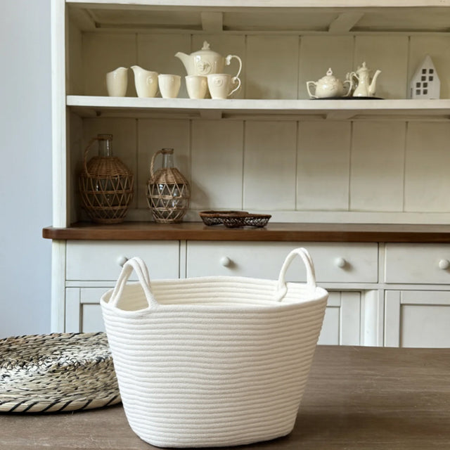 white laundry bakset on the table