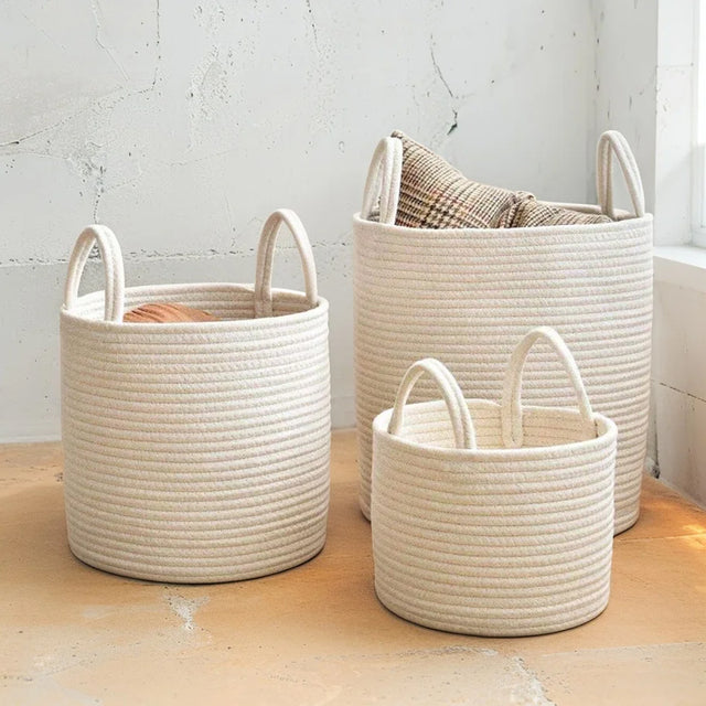 white laundry bakset set on the floor