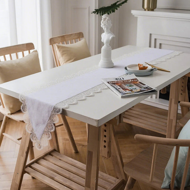 white satin lace table runner on a table