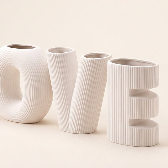 white textured LOVE letters vases closeup