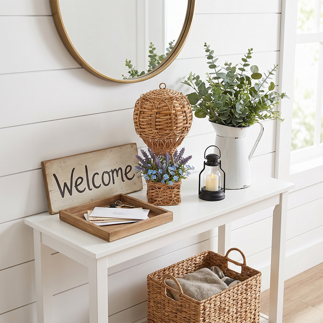 wicker hot air balloon on white entryway console