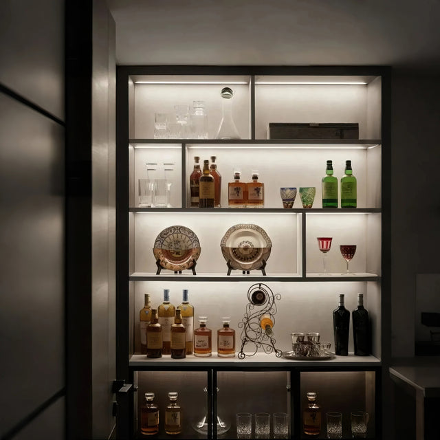 wine rack in lit cabinet