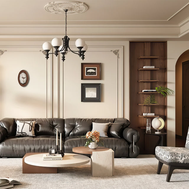 wooden bird themed picture frame wall hanging above the sofa