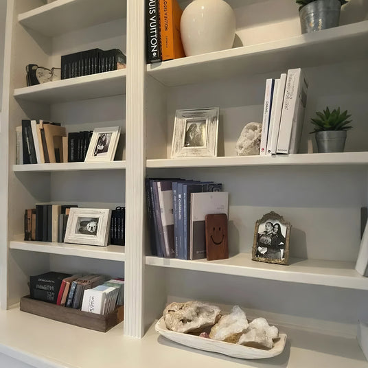 wooden bookends on bookshelf