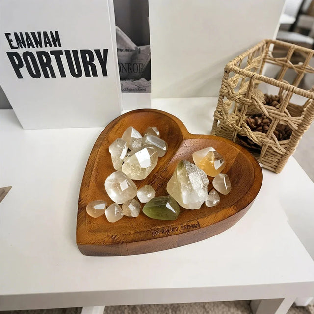 wooden prayer bowl holding crystal rocks