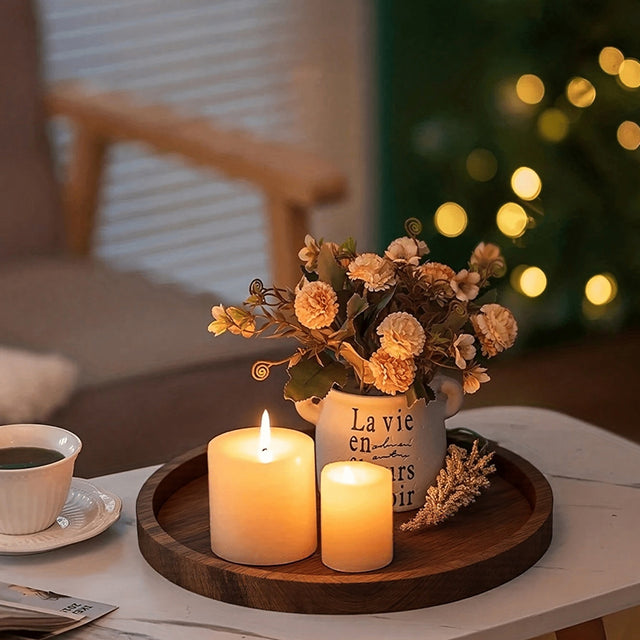 wooden tray holding candle and flowers