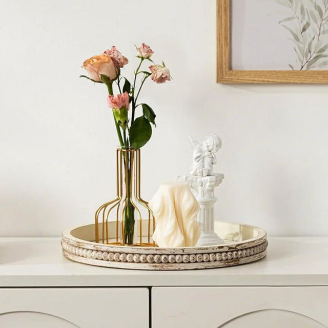 wooden tray holding decor and flowers