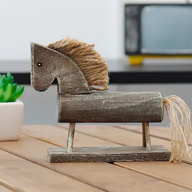 wooden trojan horse decor on the table