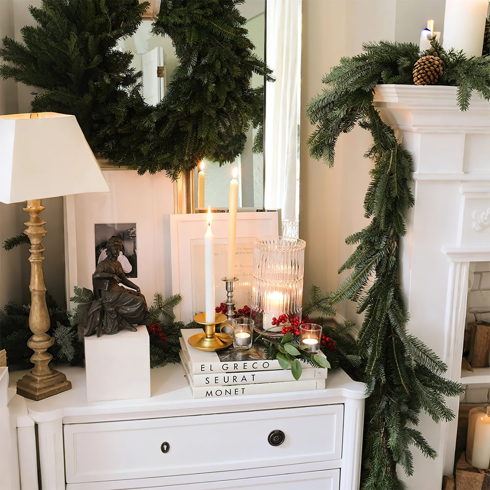wrought iron teacup candle holder on books