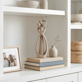 Abstract Couple Sculpture On White Shelf