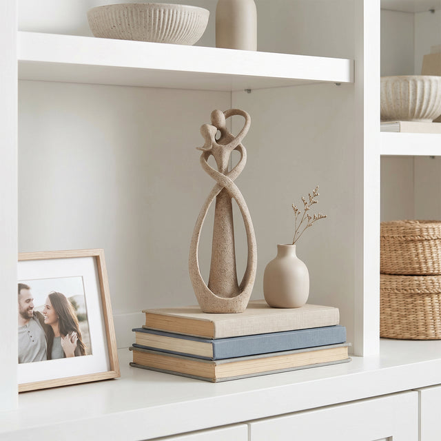 Abstract Couple Sculpture On White Shelf