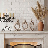 Abstract Thinker Set On Fireplace Mantel