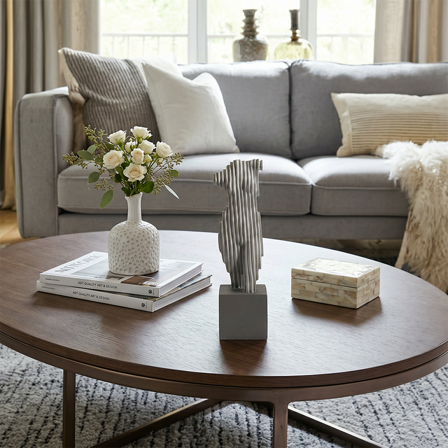 Abstract torso sculpture on round coffee table