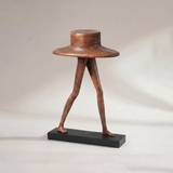 Abstract wide hat walking leg figurine