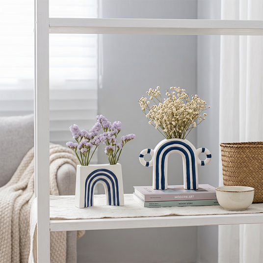 Arch ceramics displayed on storage shelf
