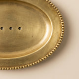 Beaded edge gold tray surface detail