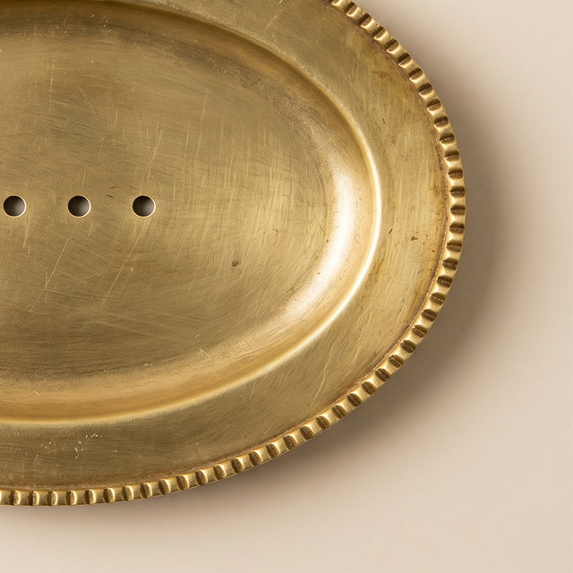 Beaded edge gold tray surface detail