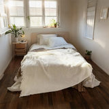Beige  and brown throw blankets on bed