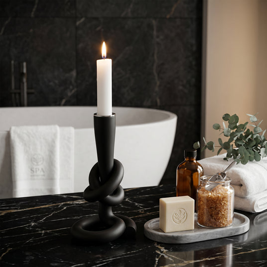 Black candlestick in bathroom space
