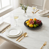Black textured bowl on marble dining table