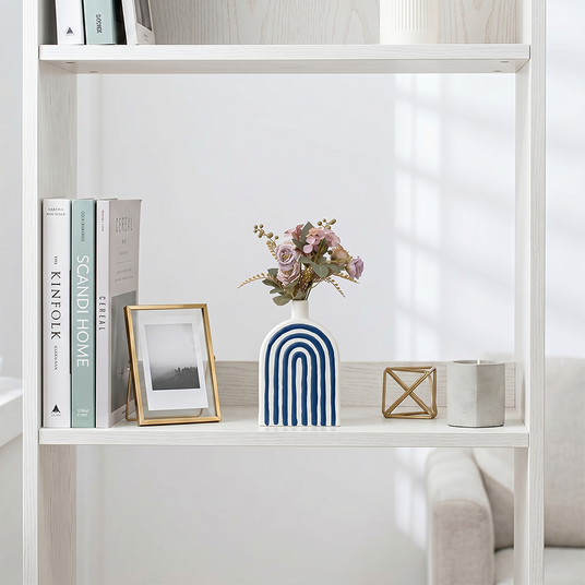 Blue arch crafts on white display shelf