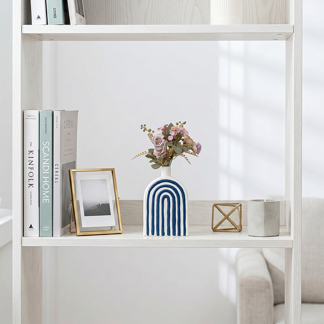 Blue arch crafts on white display shelf