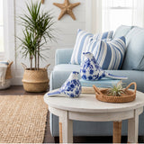 Blue bird statues on round side table