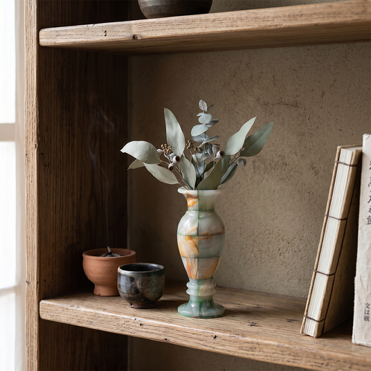 Blue vein onyx vase inside open rustic wood shelf