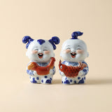 Blue white ceramic kid fish statue pair
