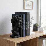 Bust bookend set on rustic wood office desk