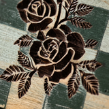 Carved brown rose texture closeup

