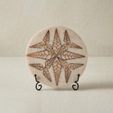 Carved stone round plaque with black metal display stand