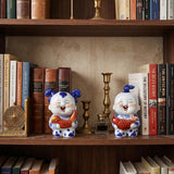 Ceramic pair displayed on wood bookshelf