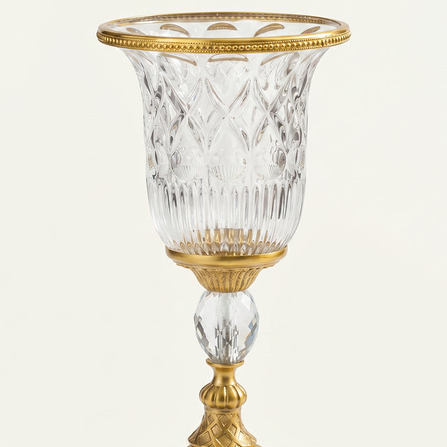 Closeup carved crystal gilded urn