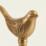 Closeup carved gold bird figurine top