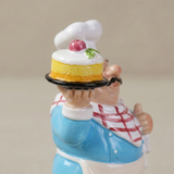 Closeup chef holding cake sculpture