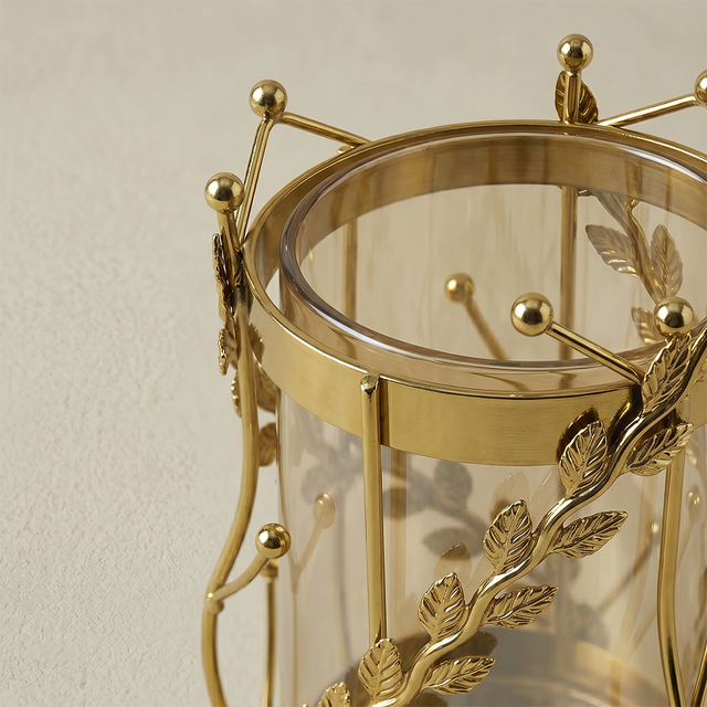 Closeup gold leaf metal vase frame