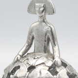 Closeup sitting silver woman statue